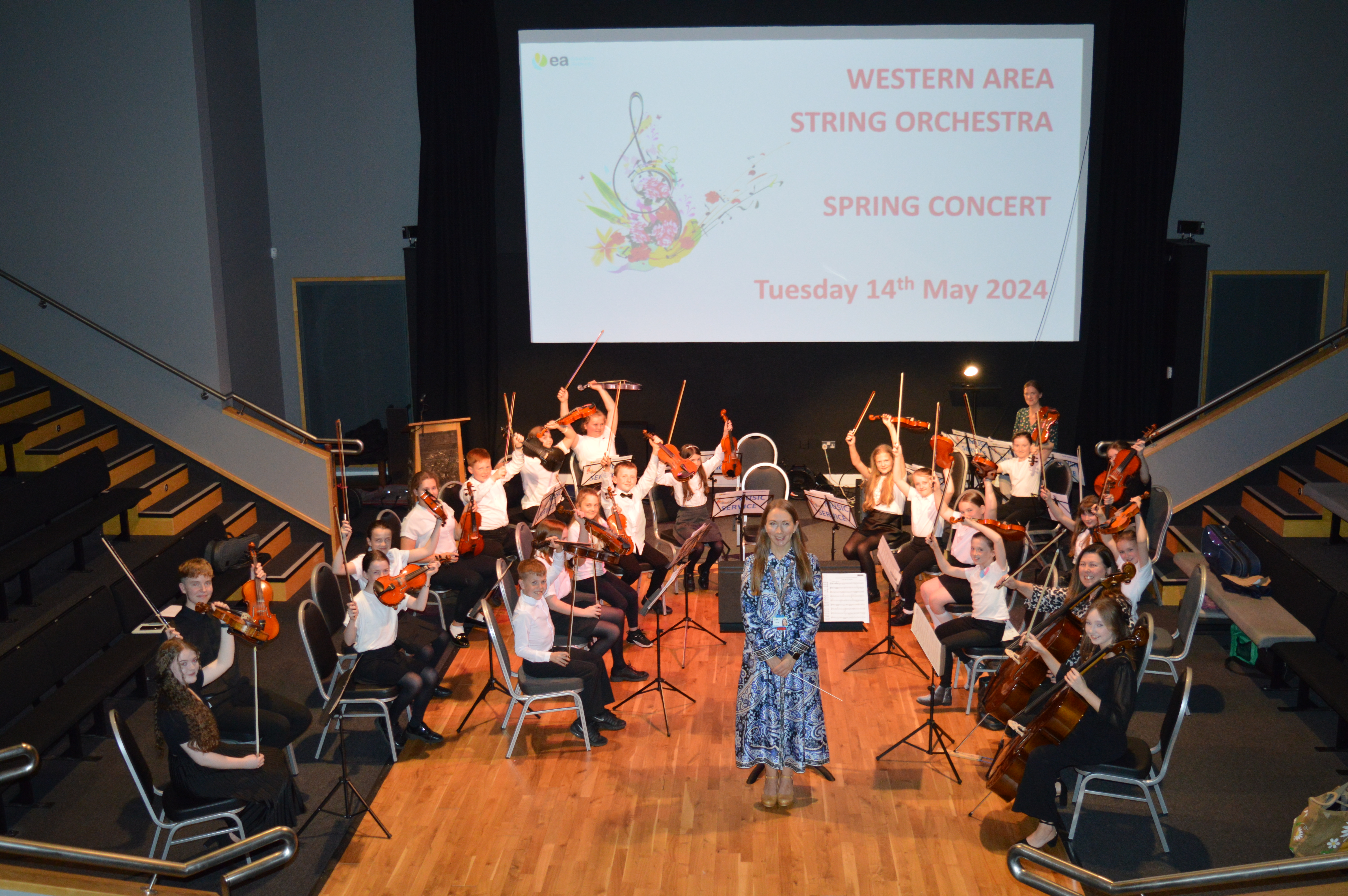 Youth orchestra on stage during concert