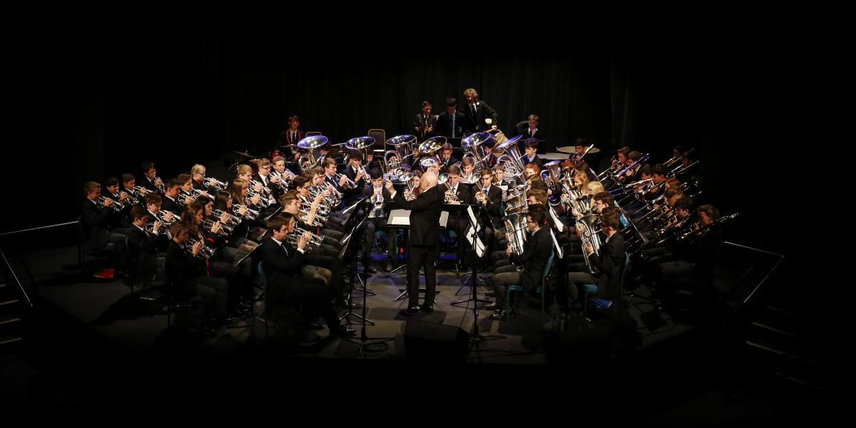 Steve Mead conducting pupils in concert