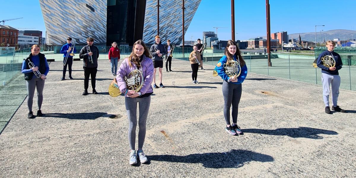 young brass musicians outside Titanic Centre Belfast