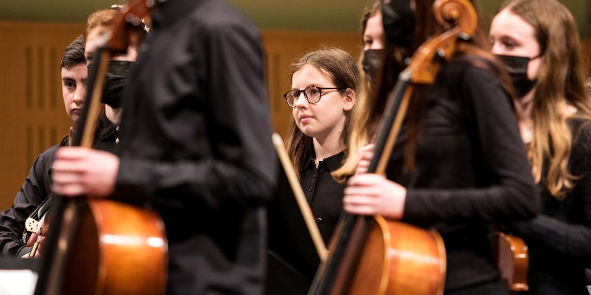 String players onstage in concert