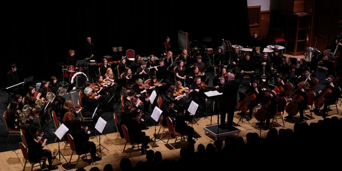 South Ulster Youth orchestra on stage in concert