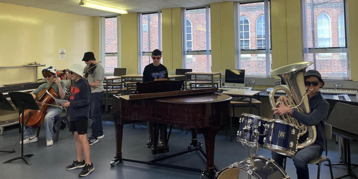 Students performing in sunglasses in summer course