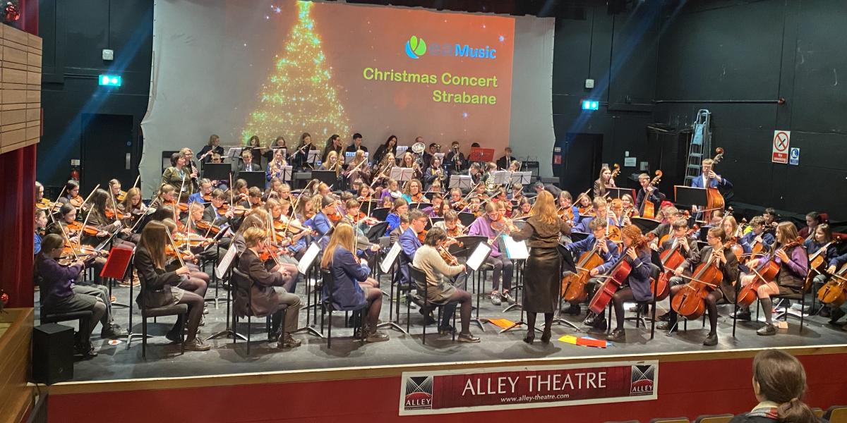Young musicians from Strabane and Omagh orchestra performing in concert