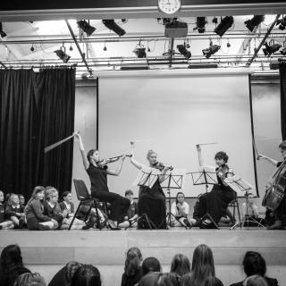 Benyounes Quartet on stage with primary school pupils