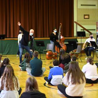 David Munn taking warm-up sessions with young musicians in Antrim