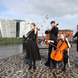 String quartet outside SS Nomadic