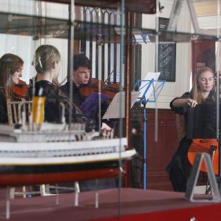 String quartet performing on board SS Nomadic