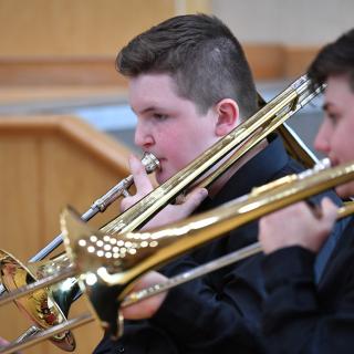 Trombone players in concert