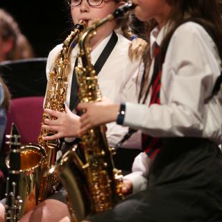 Two primary school saxophonists in concert