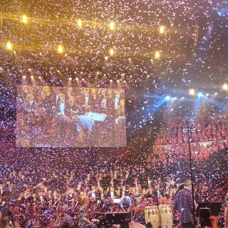 City of Belfast Youth Orchestra on stage in Royal Albert hall with confetti