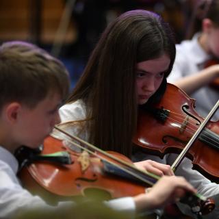 Viola section performing in youth orchestra concert