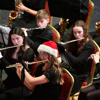 Youth band performing on stage in Christmas concert
