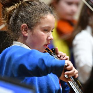 Primary school cellist in concert