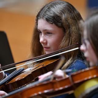 Violinists from Fermanagh Intermediate String Orchestra in concert