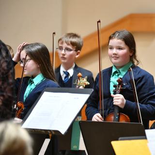Violinists from Fermanagh Intermediate String Orchestra in concert