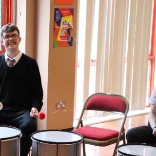 Pupil participating in percussion workshop