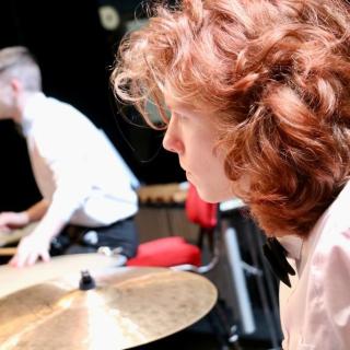 Percussion section in youth orchestra concert