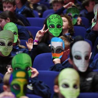 Pupils with Masks enjoying interactive Springfest roadshow