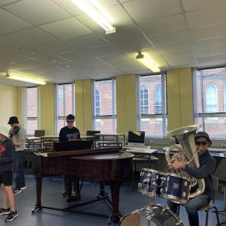 Students performing in sunglasses in summer course