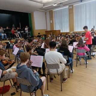 Young musicians performing in summer course concert