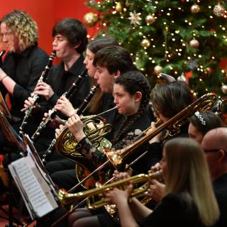 Young musicians performing in youth orchestra concert