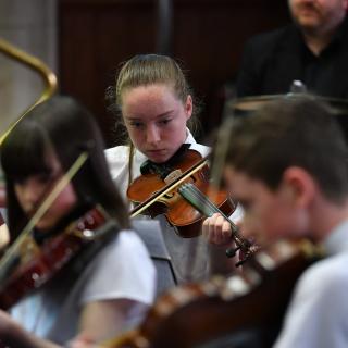 Young string players in Youth orchestra concert