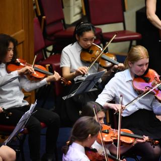 Young string players in Youth orchestra concert