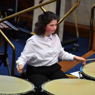 young musicians performing in wind band concert