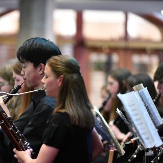 Young musicians performing in youth orchestra concert