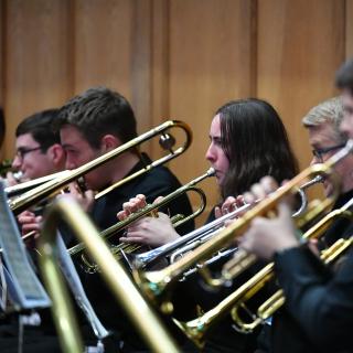Young musicians performing in youth orchestra concert