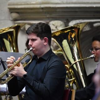 Young musicians performing in youth orchestra concert