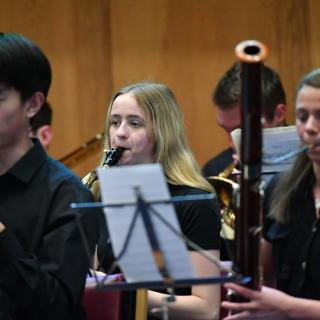 Young musicians performing in youth orchestra concert