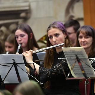 Young musicians performing in youth orchestra concert
