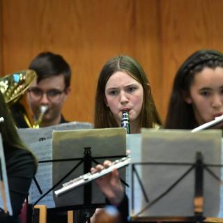 Young musicians performing in youth orchestra concert