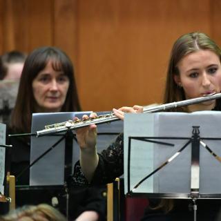 Young musicians performing in youth orchestra concert