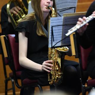 Young musicians performing in youth orchestra concert