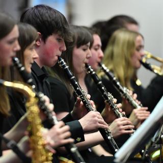 Young musicians performing in youth orchestra concert