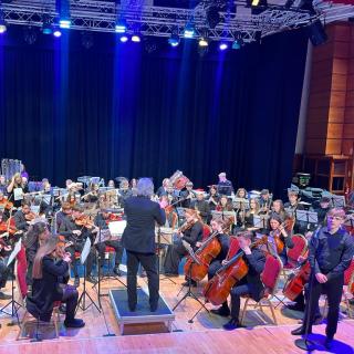 Young musicians performing in youth orchestra concert