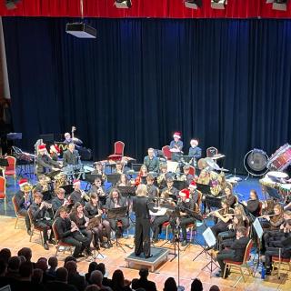 Young musicians performing in youth orchestra concert