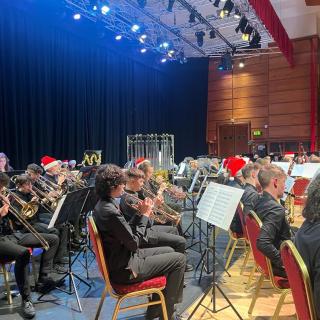Young musicians performing in youth orchestra concert