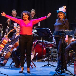 Staff orchestra on stage at Millennium Forum