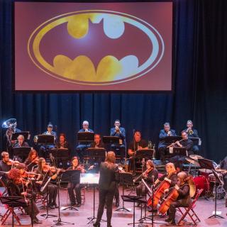 Staff orchestra on stage at Millennium Forum