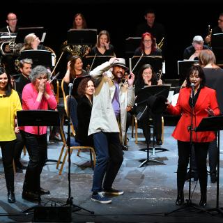 Springfest staff orchestra on stage 2023 with Musical Pathways Team
