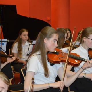 Young musicians performing in concert