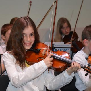 Young musicians performing in concert