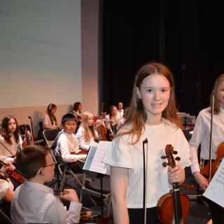 Young musicians performing in concert