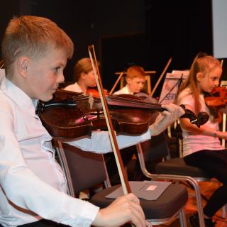 Young musicians performing in concert