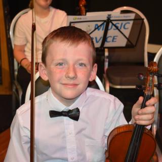 Young musicians performing in concert