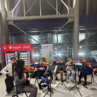 Children and young people playing violins