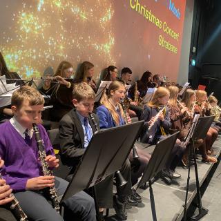 Young musicians performing in concert